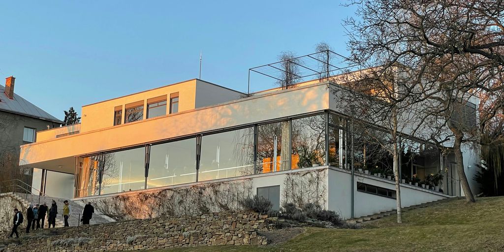 a group of people standing outside of a building